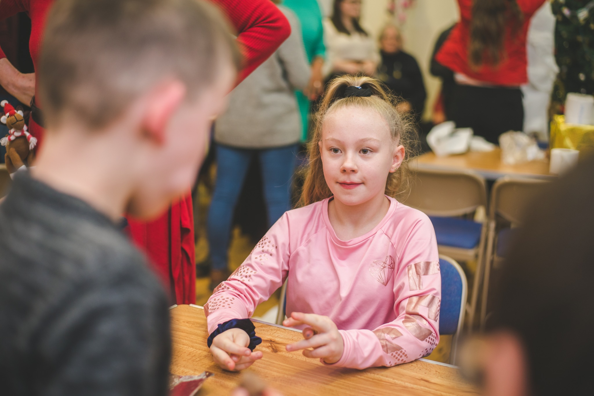 Young girl talking to another child